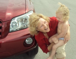 Midgee with Sky at car