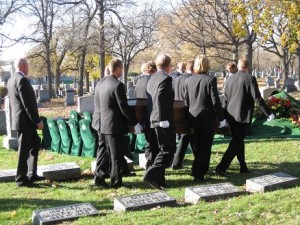 Carrying their father