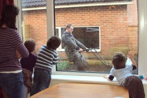 Watching Daddy rototill.