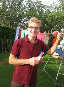 Hans hangs the clothes