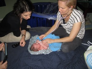 Midwives examining